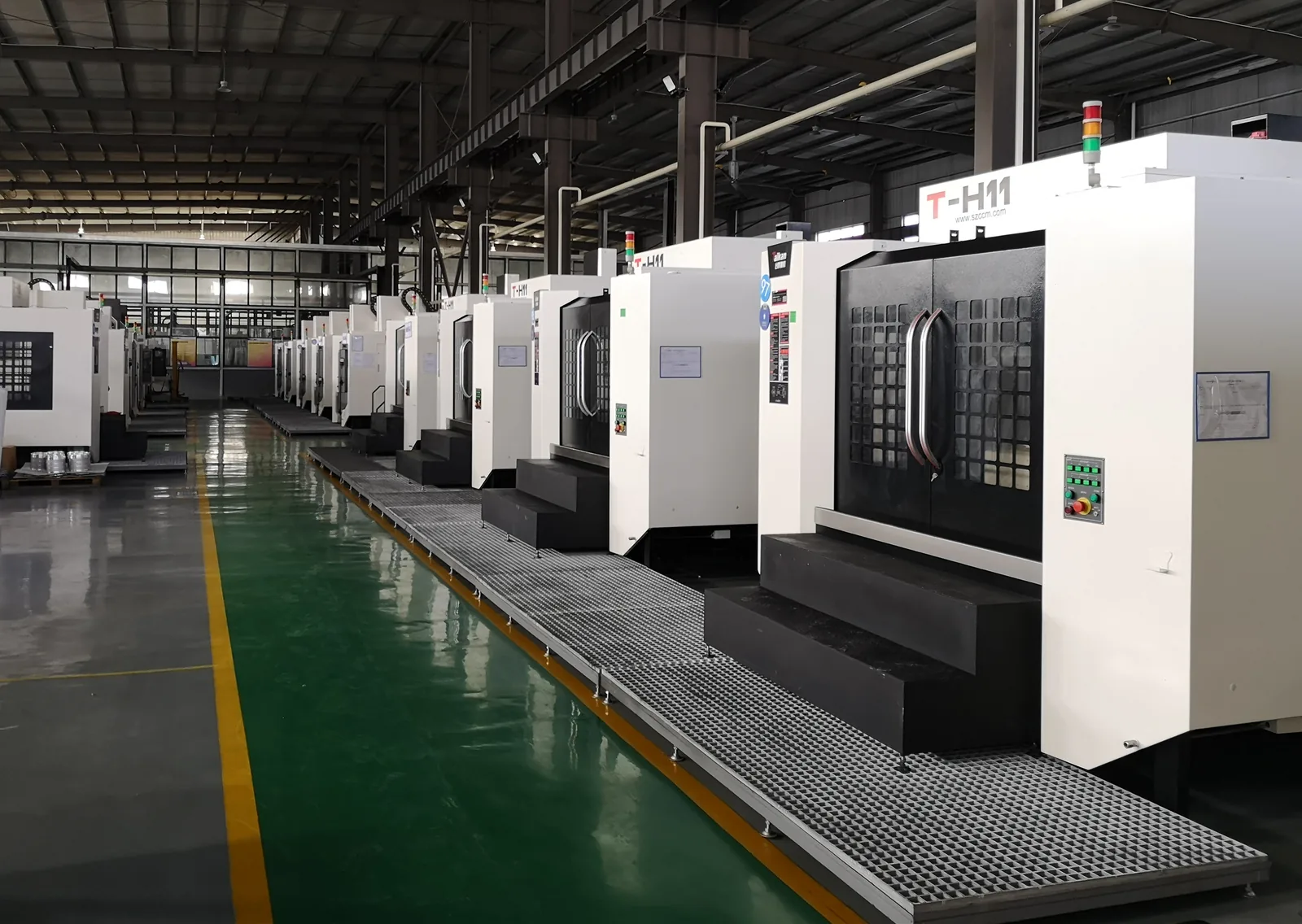 Row of CNC machining centers at a long-term strategic metal-manufacturing base